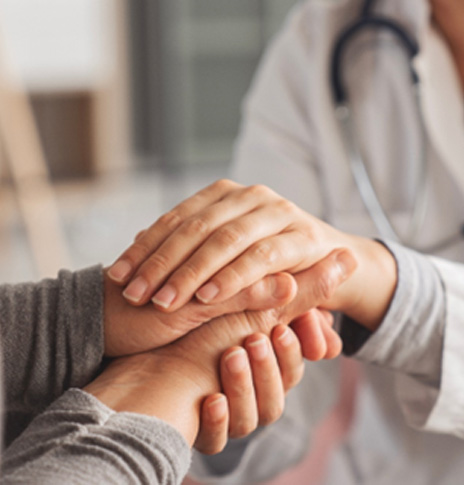 Medical professional comforting a patient