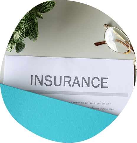 Insurance paperwork in a folder on a desk