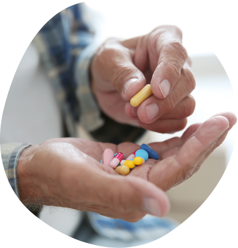 Person sorting through their pills