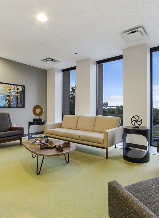 White couch and black chairs in an Austin psychiatric office