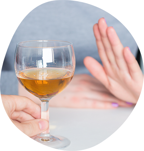 Person refusing an offer of a glass of wine