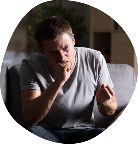 Man angrily biting his fist