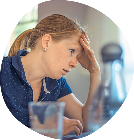 Exasperated woman touching her forehead and widening her eyes